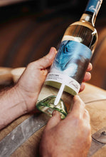 Load image into Gallery viewer, Winemaker Matt Byrne holding a bottle of Wild Cape Sauvignon Blanc wine
